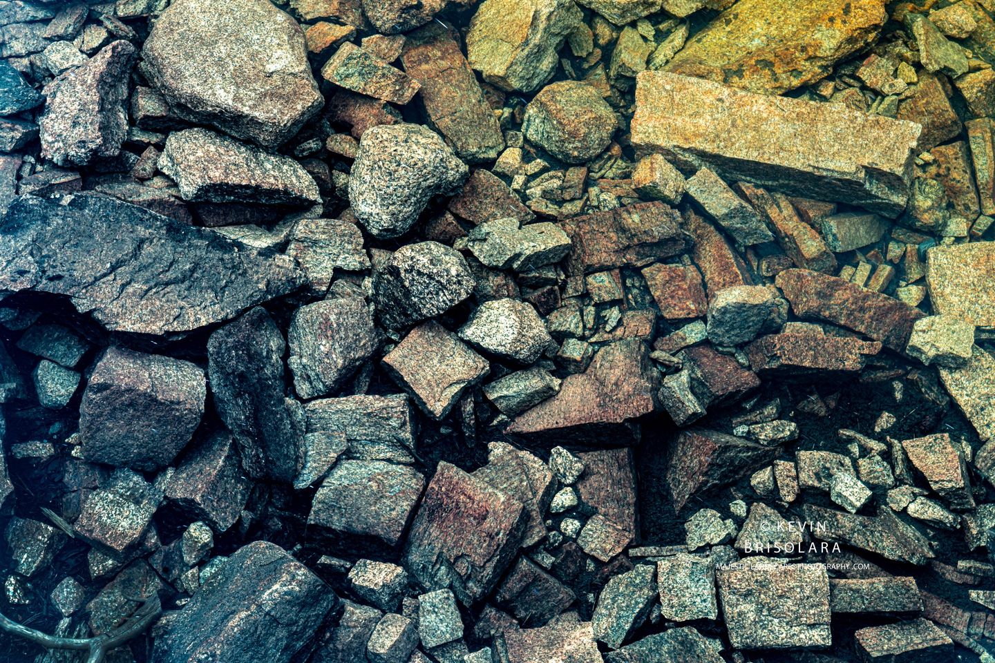 A COLLECTION OF COLORED ROCKS