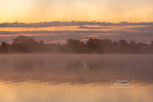 VIEWING A MISTY SUNRISE FROM THE LAKE