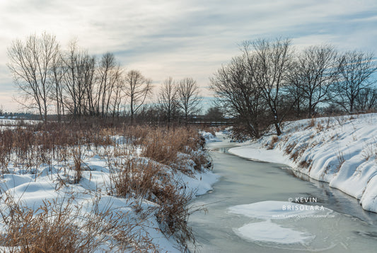 A WINTER WONDERLAND SCENE ALONG THE RIVER